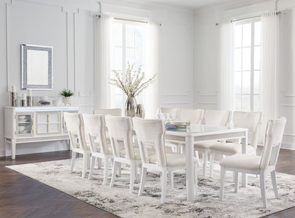 White dining room with a table and chairs in a bright room.